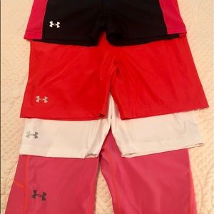 Woman’s Under Armor slides/compression shorts.